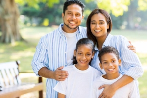 Parent classes in Livonia, Michigan for a healthy loving family. Family smiling together.