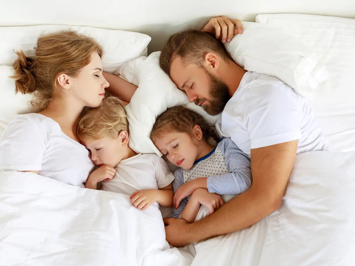 Family co-sleeping in Livonia, Michigan after online parenting class.