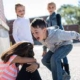 Children experiencing bullying. Girl has her head down while getting yelled at by bully.